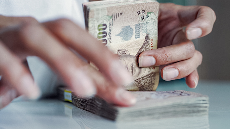 Ongebruikte Thaise baht terug wisselen